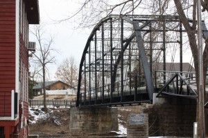 The War Eagle Bridge. The two story home beyond the bridge is the house Blackburn built for his family.